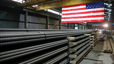 In this May 9, 2019, file photo, steel rods produced at the Gerdau Ameristeel mill in St. Paul, Minn., await shipment.