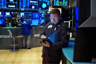 Traders work on the floor at the New York Stock Exchange in New York, Wednesday, Jan. 29, 2025.