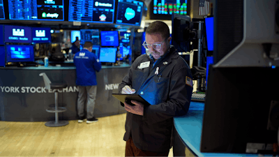 Traders work on the floor at the New York Stock Exchange in New York, Wednesday, Jan. 29, 2025.