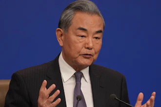 Chinese Foreign Minister Wang Yi speaks during a press conference on the sideline of the National People's Congress in Beijing, Friday, March 7, 2025.