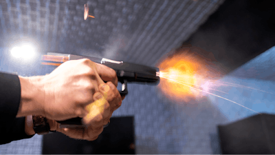 A semi-automatic pistol with a conversion device installed making it fully automatic is fired as four empty shell casings fly out of the weapon, at the Bureau of Alcohol, Tobacco, Firearms and Explosives (ATF), National Services Center, Thursday, March 2, 2023, in Martinsburg, W.Va.