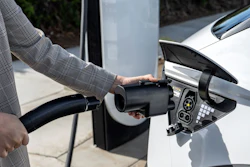 The Hyundai NACS adapter being plugged into a 2024 IONIQ 5.