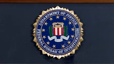 This June 14, 2018 file photo shows an FBI seal on a podium before a news conference at the agency's headquarters in Washington.