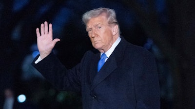 President Donald Trump waves to the media as he walks on South Lawn of the White House, in Washington, Sunday, March 9, 2025.