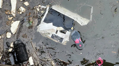 Debris floats in the water at the scene where a helicopter crashed into the Hudson River, Thursday, April 10, 2025, in Jersey City, N.J.