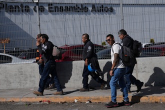 Workers arrive at the Stellantis car assembly plant in Toluca, Mexico, Thursday, April 3, 2025.