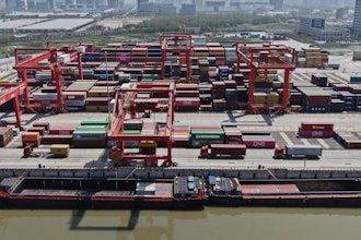 An aerial view of Xiasha Container Terminal on a canal in Hangzhou in east China's Zhejiang province Sunday, April 06, 2025.