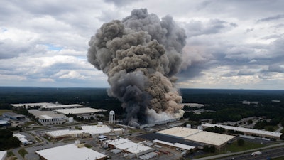 Smoke billows from a fire at the BioLab facility in Conyers, Ga., Sept. 29, 2024.