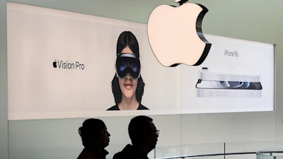 People visit an Apple Store, inside a shopping mall, in Beijing, Thursday, April 10, 2025.