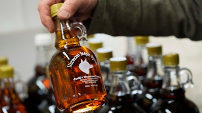 A bottle of maple syrup is placed on a shelf at Judd's Wayeeses Farms in Morgan, Vt., on Friday, April 11, 2025.