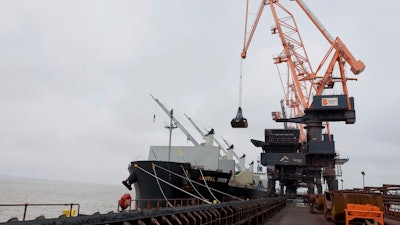 Coking coal is unloaded at Immingham Port, northern England, Tuesday, April 15, 2025.