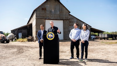 California Gov. Gavin Newsom speaks during a press conference at an almond farm in Ceres, Calif., April 16, 2025.