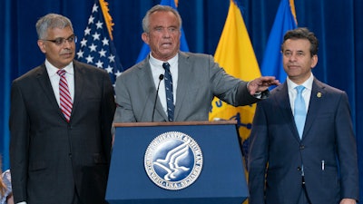 HHS Secretary Robert F. Kennedy Jr., flanked by Director of the National Institutes of Health Jay Bhattacharya, left, and FDA Commissioner Marty Makary, during a news conference at the Hubert Humphrey Building Auditorium, Washington, April 22, 2025.