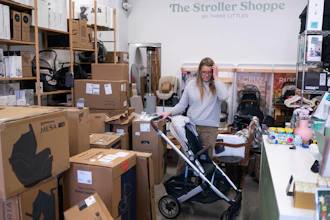 Elizabeth Mahon, owner of baby store Three Littles, unpacks strollers and other inventory ordered by customers ahead of tariff-driven price increases at her Union Market location in Washington, on Wednesday, April 16, 2025.