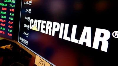 The logo for Caterpillar appears above a trading post on the floor of the New York Stock Exchange, April 23, 2018.