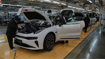Workers assemble the Zeekr 001 EV models at the Chinese automaker Zeekr assembly plant, in Ningbo, east China's Zhejiang Province, Wednesday, April 17, 2025.