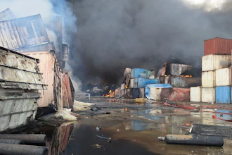 Containers burn, Sunday, April 27, 2025, after a massive explosion and fire rocked a port near the southern port city of Bandar Abbas, Iran, on Saturday.