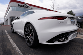 An unsold 2021 F-Type coupe sits at a Jaguar dealership in this photograph taken Sunday, May 2, 2021, in Littleton, Colo.