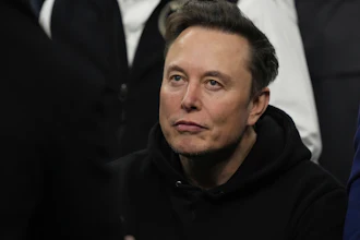 Elon Musk attends the finals for the NCAA wrestling championship, Saturday, March 22, 2025, in Philadelphia.