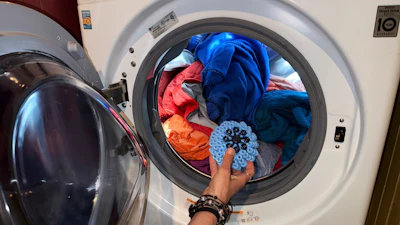 Rachael Z. Miller, founder of the Vermont-based Rozalia Project for a Clean Ocean, tosses a Cora Ball, a laundry ball that can be tossed into the washer to cut down on clothes banging into each other, on Thursday, April 17, 2025, in Granville, VT.