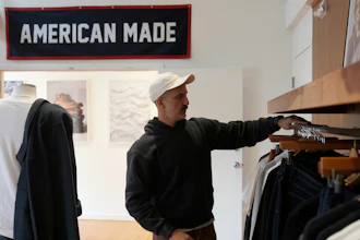 Javid Moghaddasnia, Director of Customer Engagement, discusses American Giant clothing while being interviewed at the company's showroom in San Francisco, Thursday, April 17, 2025.