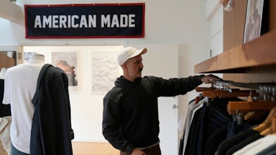 Javid Moghaddasnia, Director of Customer Engagement, discusses American Giant clothing while being interviewed at the company's showroom in San Francisco, Thursday, April 17, 2025.