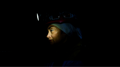 Oksana Polischuk, 51, descendes by lift into a coal mine in Dnipropetrovsk region, Ukraine, Jan. 30, 2025. Polischuk, lost her husband on a war, she became an IDP in Poland. She decided to return to Ukraine and be useful for her country working on a coal mine underground.