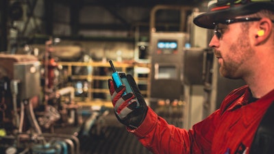 A frontline worker uses the Walt Smart Radio System.