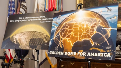 Posters for the proposed Golden Dome for America missile defense shield are displayed before an event with President Donald Trump in the Roosevelt Room at the White House, Monday, May 12, 2025, in Washington.