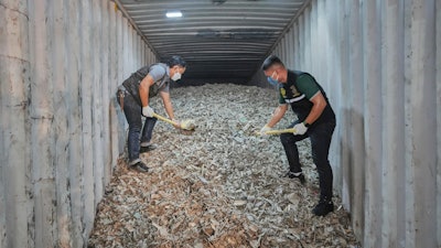 Thai officials show samples of illegally imported electronic waste from the United States which they said they seized at Bangkok Port during a press conference in Bangkok, Thailand, Wednesday, May 14, 2025.