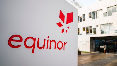 A sign for the company Equinor is displayed on Oct. 28, 2020, in Fornebu, Norway.