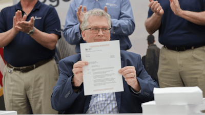 In this photo provided by Tennessee Valley Authority, Scott Hunnewell, vice president of the utility’s New Nuclear Program, signs the construction permit application to build a small modular reactor, Monday, May 19, 2025, in Chattanooga, Tenn.