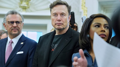 Elon Musk looks on as President Donald Trump meets South African President Cyril Ramaphosa in the Oval Office of the White House, Wednesday, May 21, 2025, in Washington.