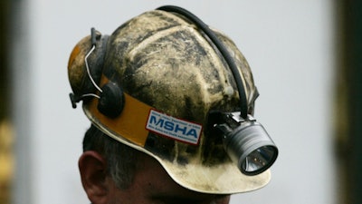 A miner gathers his thought before taking part in a rescue mission, Tuesday, Jan. 3, 2006, in Tallmansville, W.Va.