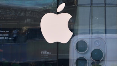 People visit an Apple store promoting its iPhone 16 at an outdoor shopping mall in Beijing, Sunday, May 11, 2025.