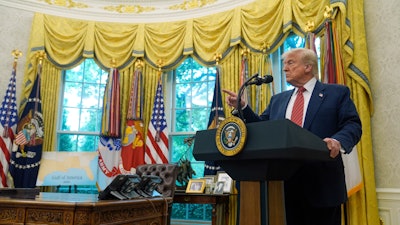 President Donald Trump speaks to reporters after David Perdue was sworn in as U.S. Ambassador to China during a ceremony in the Oval Office of the White House, Wednesday, May 7, 2025, in Washington.