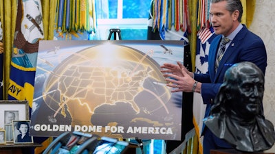 Defense Secretary Pete Hegseth speaks during an event with President Donald Trump in the Oval Office of the White House, Tuesday, May 20, 2025, in Washington.