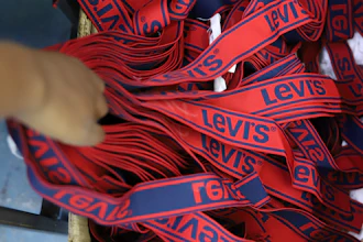 A label reading 'Levis' on a pair of Levi Strauss & Co jeans is displayed at a production line at United Aryan EPZ Limited in Ruaraka on the outskirts of Nairobi, Kenya, March. 21, 2025.