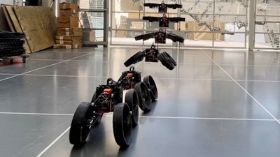 The ATMO (aerially transforming morphobot) robot transforms from its flying, quadrotor configuration midair as it approaches the ground.