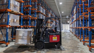A forklift worker transports goods at a warehouse in San Juan, Puerto Rico, Thursday, May 8, 2025.