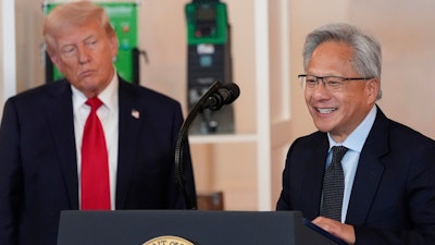 President Donald Trump listens as Nvidia CEO Jensen Huang speaks during an event about investing in America in the Cross Hall of the White House, Wednesday, April 30, 2025, in Washington.