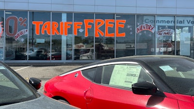 A 'Tariff Free' sign displayed at a car dealership in Totowa, N.J., April 30, 2025.