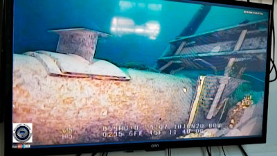 In this photo shot from a television screen provided by the Michigan Department of Environment, Great Lakes, and Energy in June 2020, shows damage to anchor support EP-17-1 on the east leg of the Enbridge Line 5 pipeline within the Straits of Mackinac in Mich.