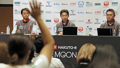 ispace CEO and founder Takeshi Hakamada, center, attends a press conference about their private lunar lander's attempt on the moon Friday, June 6, 2025, in Tokyo, Japan.