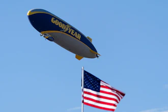 The Goodyear blimp hovers above the 16th hole during the Phoenix Open golf tournament, Sunday, Feb. 12, 2023, in Scottsdale, Ariz.