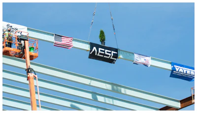 Construction crews prepare to mount the final structural steel beam on the 1.6 million-square-foot AESC gigafactory being constructed in the Kentucky Transpark in Bowling Green, Ky., during the facility's 'Topping Out' structural completion milestone ceremony on Thursday, Sept. 14, 2023.