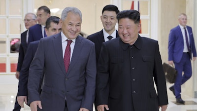 In this photo provided by the North Korean government, North Korean leader Kim Jong Un, front right, meets with Russian Security Council Secretary Sergei Shoigu, left, at the headquarters of the ruling Workers' Party in Pyongyang, North Korea, Tuesday, June 17, 2025. Independent journalists were not given access to cover the event depicted in this image distributed by the North Korean government. The content of this image is as provided and cannot be independently verified. Korean language watermark on image as provided by source reads: 'KCNA' which is the abbreviation for Korean Central News Agency.
