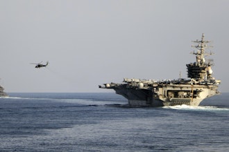 The aircraft carrier USS Dwight D. Eisenhower and other warships cross the Strait of Hormuz, Nov. 26, 2023.