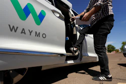 A Waymo minivan arrives to pick up passengers for an autonomous vehicle ride, April 7, 2021, in Mesa, Ariz.