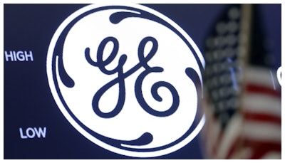 In this June 26, 2018, file photo the General Electric logo appears above a trading post on the floor of the New York Stock Exchange.